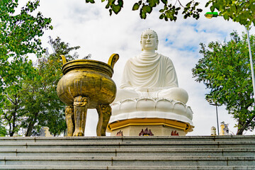 A white Buddha on a lotus flower.  Lang Son Pagoda (Chùa Long Sơn) is the main Buddhist temple of...