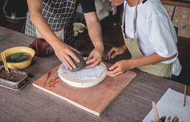 Fototapeta na wymiar The master class in big workshop on making clay products