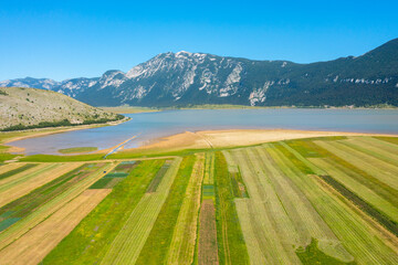  A beautiful landscape with cultivated land, a lake and a mountain - an excellent example of leading lines