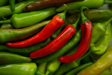 Hot chili pepper background. Red and green peppercorns as a background. Healthy food concept.