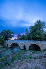 Romanesque bridge of Artigue and river Osse near Larressingle on route to Santiago de Compostela, UNESCO World Heritage Site, departement Gers, France