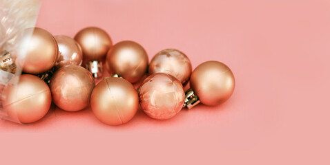 Christmas balls in old pink color over pink nackground like xmas holiday background 