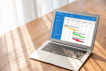 Project planning software for modish business project management on the computer screen showing...