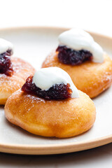 fried muffins with plum jam and sour cream