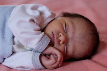 close up shot of a sleeping cute newborn baby 