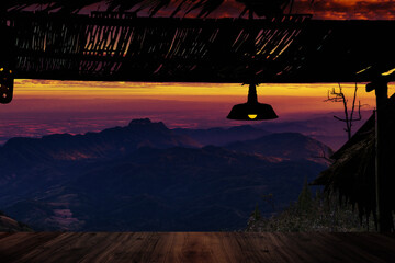 Peaceful sunset nature, Roof silhouette with lanterns looking out into the mountains.