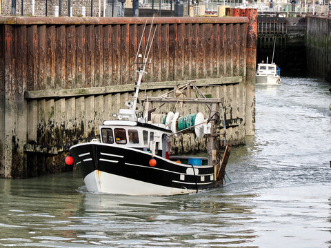 Fishing boat leaving a lock at Le Treport, a commune in the Seine-Maritime department in Normandy, in northwestern France. 