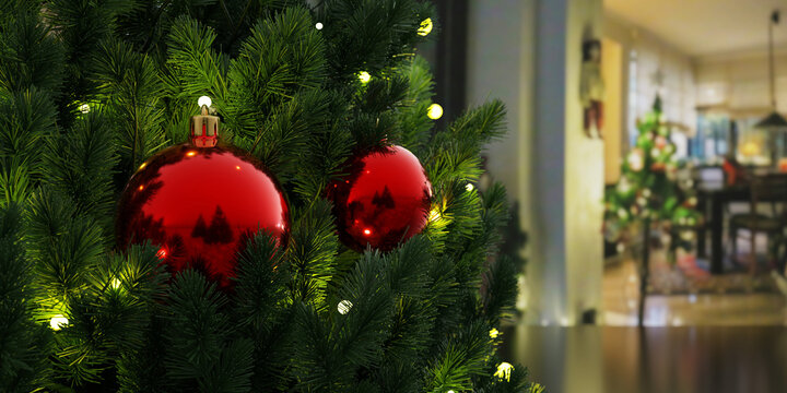 Christmas tree decoration, red baubles and lights. Warm cozy home background.