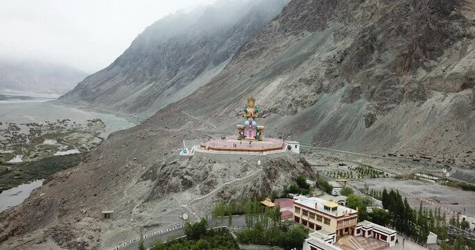 Lord Buddha statue against blue sky, Diskit Monastery in Nubra Valley, Leh, Ladakh
