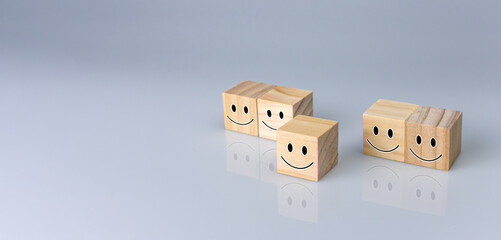 Obraz premium Smiles on the cube. It represents positive ratings, feedback and customer reviews. Satisfaction Concept, Satisfaction Survey, Mental Health Assessment, Positive Thinking Concept.