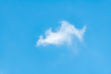Fototapeta na wymiar Isolated white cloud against light blue skies, abstract photographs