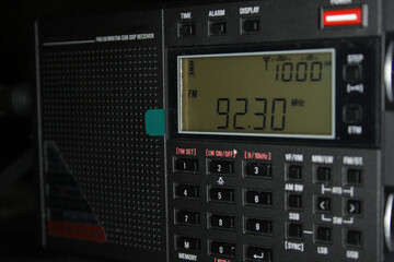Part of a modern radio receiver open for reception on an FM station