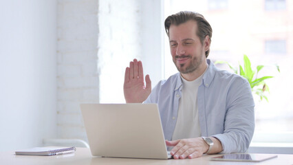 Online Video Call by Young Man in Office