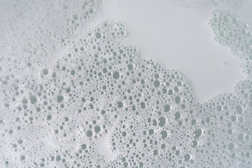 Background of foam and bubbles. A soapy bath in the bathtub.