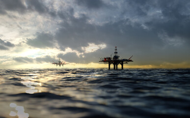 Fototapeta na wymiar Oil platform at the sea during sunset. . Offshore oil rig, drilling rig, jack up rig, Oil and gas crisis. 3D rendering illustration