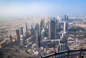 Fototapeta na wymiar Dubai city view at sunset. Famous skyscrapers along the Sheik Zayed Road