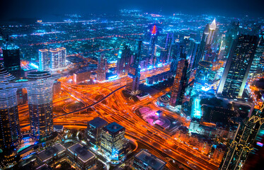 Fototapeta na wymiar Dubai city at night, view with lit up skyscrapers and roads. 