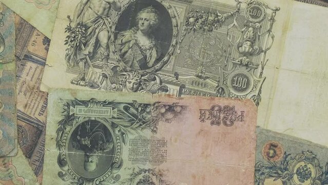 Old paper money of the Russian Empire of the 19th century. Retro banknote of Russian empire. Сlose-up of old banknotes of the tsarist Russian empire rotating. Antiques money, royal rubles rotate