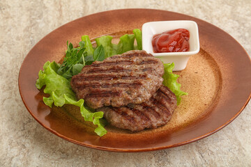 Grilled beef burger cutlet with sauce