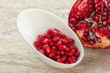 Ripe red Pomegranate seeds in the bowl