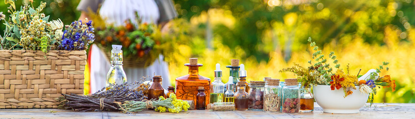 Grandmother makes tinctures from medicinal herbs. Selective focus.