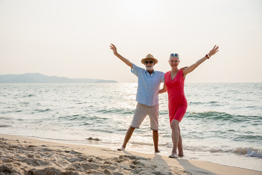Senior couple relaxing and spend time together at tropical beach., Healthy seniors lifestyle concept.