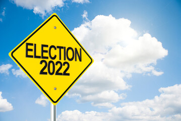 Road sign Election 2022 on sky