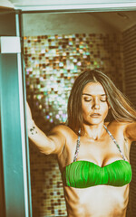 Beautiful girl relaxing in sauna at spa center
