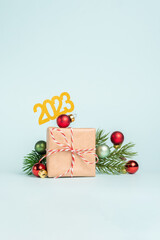 New year gift box. Craft paper and red ribbon