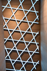 Pattern of lines and wood along a modern facade