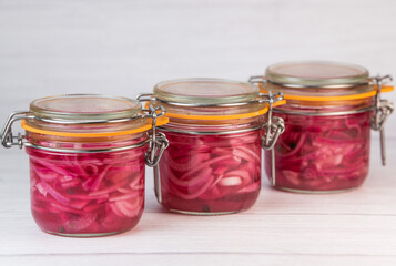 RECIPE FOR ONION PICKLES IN JARS, WHITE WINE VINEGAR, WHITE WINE, SUGAR, PEPPER. High quality photo