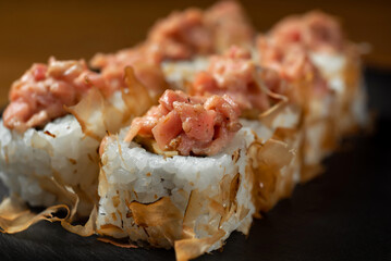 Japanese national dish of sushi, rolls with red fish and salmon chips