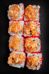 Japanese national dish of sushi, rolls with red fish and salmon chips
