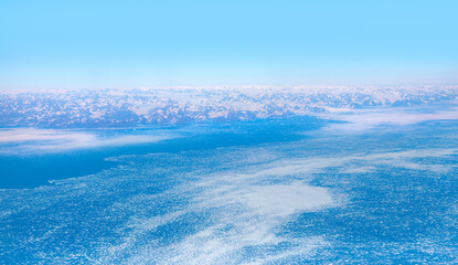 View from airplane of melting polar ice cap Greenland
