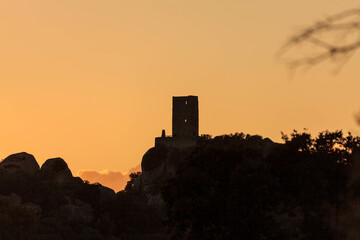 Obraz premium suggestive image of castle Pedres in Olbia, Sardinia, at sunset.