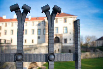 View over iron fence to Nelahozeves Chateau, finest Renaissance castle, Czech Republic. - obrazy, fototapety, plakaty