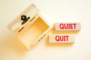 Quiet quit symbol. Concept words Quiet quit on wooden blocks. Beautiful white table white...