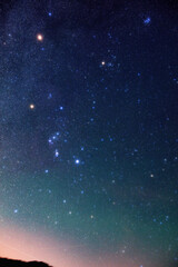 Milky Way stars and constellations on evening sky. Orion constellation with Mars and Pleiades star...