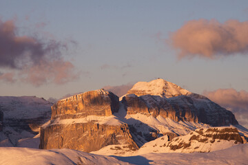 sunset in the dolomites covered by snow