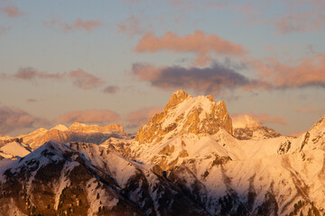 sunset in the dolomites covered by snow