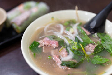 Vietnamese pho rice noodle with raw beef
