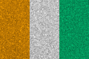 Fototapeta premium Flag of Ivory Coast on styrofoam texture. national flag painted on the surface of plastic foam
