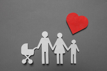 Paper family figures and red heart on grey background, flat lay. Insurance concept
