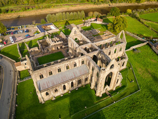 Aerial view of an ancient ruined cistercian monastery (Tintern Abbey, Wales. Built circa 12th...