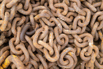 Close-up of an anchor chain, spiked, giant chain links. Anchor rusty chain close-up. Large iron...