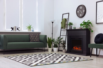 Stylish living room interior with decorative fireplace and sofa