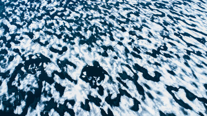 Open water fractured shelf ice from a melting glacier for a background or banner