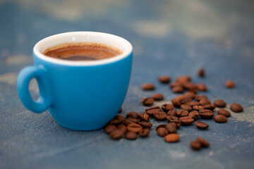 Black coffee in blue cup. Fresh coffee for a break.