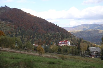 Picturesque view of houses and trees in mountains