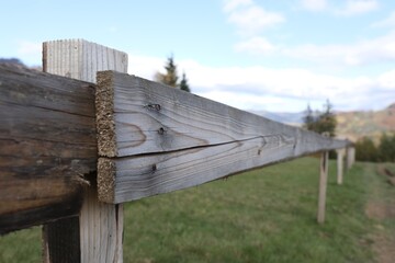 Closeup view of old wooden fence outdoors